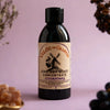 Bottle of Valèe de Galène Chicory Root Concentrate Elderberry on a pink background