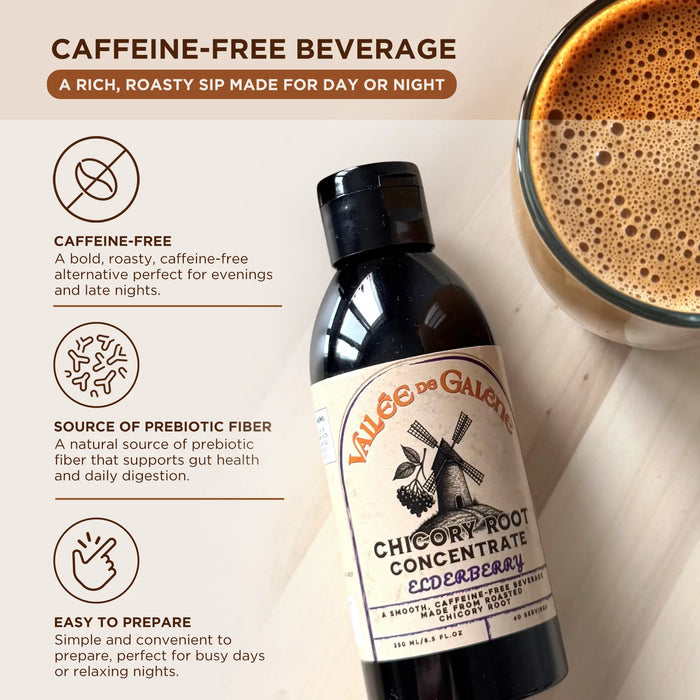 A bottle of Vallee de Galene Chicory Root concentrate with Elderberry is laying on a table next to glass with foamy chicory beverage.