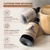Caffeine-free beverage bottles with a glass of the product on a light background