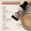Bottle of Vallee de Galene chicory root concentrate with a cup of coffee on a wooden surface.