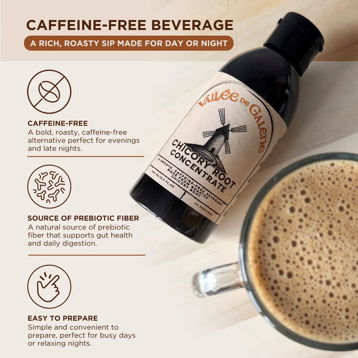 Bottle of Vallee de Galene chicory root concentrate with a cup of coffee on a wooden surface.