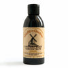 Bottle of Chicory Root Concentrate with a black cap on a white background